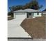 Charming single-story home featuring an attached two-car garage and freshly laid front yard at 4031 Sw 130Th Loop, Ocala, FL 34473