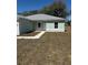 Front exterior view of a charming single-story home with a fresh lawn at 4031 Sw 130Th Loop, Ocala, FL 34473