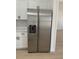 Stainless steel refrigerator with white cabinets and stainless steel appliances in new home at 4031 Sw 130Th Loop, Ocala, FL 34473