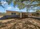 Charming single-story home featuring a covered front porch and carport at 411 Thomas Ave, Frostproof, FL 33843