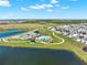 Aerial perspective highlighting the community's pool, recreational area, walking paths, and nearby residential homes at 4180 Bull St, St Cloud, FL 34772