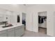 Bright bathroom with double vanity, walk-in closet, and tiled floors at 4180 Bull St, St Cloud, FL 34772