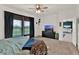Bright bedroom with large windows, offering plenty of natural light and views at 4180 Bull St, St Cloud, FL 34772