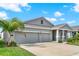Beautiful one story home with a well-maintained lawn, and a two-car garage at 4180 Bull St, St Cloud, FL 34772