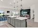 Spacious kitchen with an island overlooking the living room and dining area, great for entertaining at 4180 Bull St, St Cloud, FL 34772