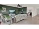 Cozy living room with dark accent wall, large television, and comfortable seating at 4180 Bull St, St Cloud, FL 34772