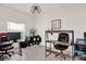 Bright home office features tile floors, modern light fixture, and plenty of workspace at 4180 Bull St, St Cloud, FL 34772