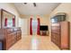 Bedroom with tile flooring, dresser, and ample natural light at 449 Martigues Drive, Kissimmee, FL 34759