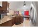 Kitchen with brown cabinetry, granite counters, and stainless steel appliances at 449 Martigues Drive, Kissimmee, FL 34759