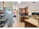 Kitchen featuring stainless steel appliances, tile flooring and granite countertops at 449 Martigues Drive, Kissimmee, FL 34759