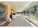 Spacious screened-in patio with tiled floor that extends the length of the house at 449 Martigues Drive, Kissimmee, FL 34759