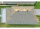 Aerial view of a beautifully roofed residence showcasing the surrounding greenery at 4778 Cragmere Loop, Clermont, FL 34711