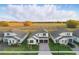 Aerial view showcases an attractive community with well-maintained homes and lush surroundings at 4778 Cragmere Loop, Clermont, FL 34711