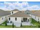 The backyard is perfect for entertaining with its large sliding glass doors and paved patio at 4778 Cragmere Loop, Clermont, FL 34711