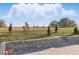 Expansive backyard featuring a brick-paved patio and a beautiful scenic pasture beyond the fence at 4778 Cragmere Loop, Clermont, FL 34711