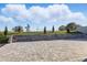 Backyard featuring brick pavers, retaining wall, and lush landscaping at 4778 Cragmere Loop, Clermont, FL 34711