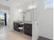 Modern bathroom featuring double sinks, granite countertops, and a glass enclosed shower at 4778 Cragmere Loop, Clermont, FL 34711