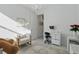 Bedroom with natural light, chandelier, stylish chair and modern vanity at 4778 Cragmere Loop, Clermont, FL 34711