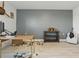 Bonus room with wood flooring, airplane propeller decor, desk, and accent wall at 4778 Cragmere Loop, Clermont, FL 34711