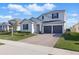 Charming two-story home featuring a double garage, well-manicured lawn, and classic curb appeal at 4778 Cragmere Loop, Clermont, FL 34711