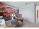 Bright home office with custom mural wall, stylish desk and ample natural light at 4778 Cragmere Loop, Clermont, FL 34711