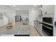 Well-equipped kitchen featuring granite countertops, a stainless steel fridge, and modern appliances at 4778 Cragmere Loop, Clermont, FL 34711