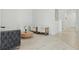 Open living space with neutral tones, wood flooring, and two white chairs at 4778 Cragmere Loop, Clermont, FL 34711