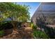 Private backyard with lush greenery and a screened-in pool, perfect for relaxation and enjoying the outdoors at 5011 Dorian Ave, Belle Isle, FL 32812