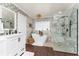 Lovely bathroom with a soaking tub, walk-in shower, and double vanity with elegant fixtures at 5011 Dorian Ave, Belle Isle, FL 32812
