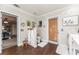 Beautiful bathroom showing toilet, doorway with blind, and a peek into the main bedroom at 5011 Dorian Ave, Belle Isle, FL 32812