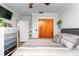 Comfortable bedroom featuring a closet, dresser, and neutral color palette for a calm atmosphere at 5011 Dorian Ave, Belle Isle, FL 32812