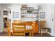 Dining area features a round table, wood chairs, and a hutch with decor at 5011 Dorian Ave, Belle Isle, FL 32812