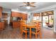 Inviting dining area with wood floors, a view of the lanai and pool, and wooden cabinets at 5011 Dorian Ave, Belle Isle, FL 32812