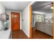 Welcoming entryway with a solid wood door, ceramic flooring, and a view into the living room at 5011 Dorian Ave, Belle Isle, FL 32812