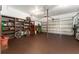 Spacious garage with ample storage shelving, an epoxy floor, and plenty of room for parking at 5011 Dorian Ave, Belle Isle, FL 32812