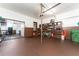 Spacious garage with shelving, storage, and access to an additional workspace at 5011 Dorian Ave, Belle Isle, FL 32812
