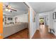 Bright, open living room with hardwood floors and a large sofa adjacent to the dining room at 5011 Dorian Ave, Belle Isle, FL 32812