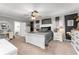 Spacious primary bedroom with carpet, neutral walls, and attached bath featuring a walk-in shower at 5011 Dorian Ave, Belle Isle, FL 32812