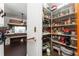 Walk-in pantry featuring ample shelving for organized storage of food and household items at 5011 Dorian Ave, Belle Isle, FL 32812