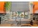 A kitchen window over the sink has a pleasant view of the outdoor pool, patio, and backyard plants at 5011 Dorian Ave, Belle Isle, FL 32812