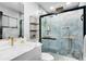 Modern bathroom with marble countertops, waterfall shower, and floating shelves at 5404 E Sacramento Ct, Orlando, FL 32821