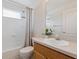 Bathroom featuring a tub and shower combo, single sink, and natural lighting at 5619 Bear Stone Run, Oviedo, FL 32765