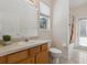 Bathroom with tub and shower combo, single sink, and natural lighting at 5619 Bear Stone Run, Oviedo, FL 32765
