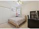 Bedroom with closet, ceiling fan and a window letting in natural light at 5619 Bear Stone Run, Oviedo, FL 32765