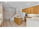 Clean kitchen with island, white countertops, and bright natural light, perfect for culinary adventures at 5619 Bear Stone Run, Oviedo, FL 32765