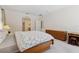 Serene main bedroom with a bed, dresser, nightstand, and a view to the en-suite bath at 5619 Bear Stone Run, Oviedo, FL 32765