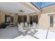 Covered patio featuring a dining set, ceiling fan, and sliding glass doors for indoor-outdoor living at 5619 Bear Stone Run, Oviedo, FL 32765