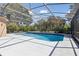 Relaxing screened-in pool featuring a sparkling pool and ample deck space for entertaining or lounging at 5619 Bear Stone Run, Oviedo, FL 32765