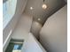 Modern foyer with high ceilings, contemporary lighting, and a view of the staircase at 7028 Rolling Leaf Rd, Groveland, FL 34736