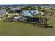 Community playground featuring slides and climbing structures under a shaded canopy at 7028 Rolling Leaf Rd, Groveland, FL 34736